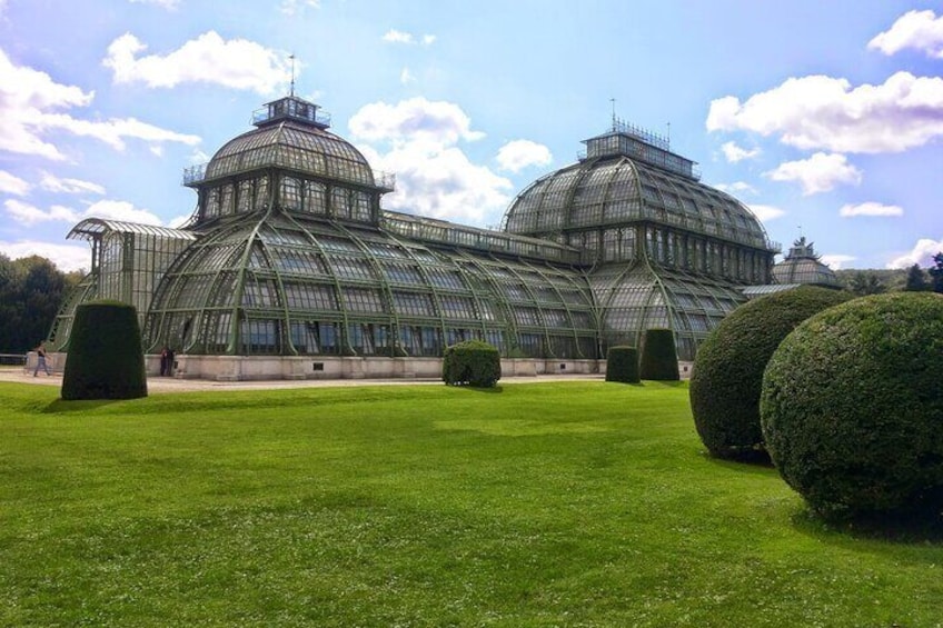 Palm house in the castle garden in front of the entrance to the zoo