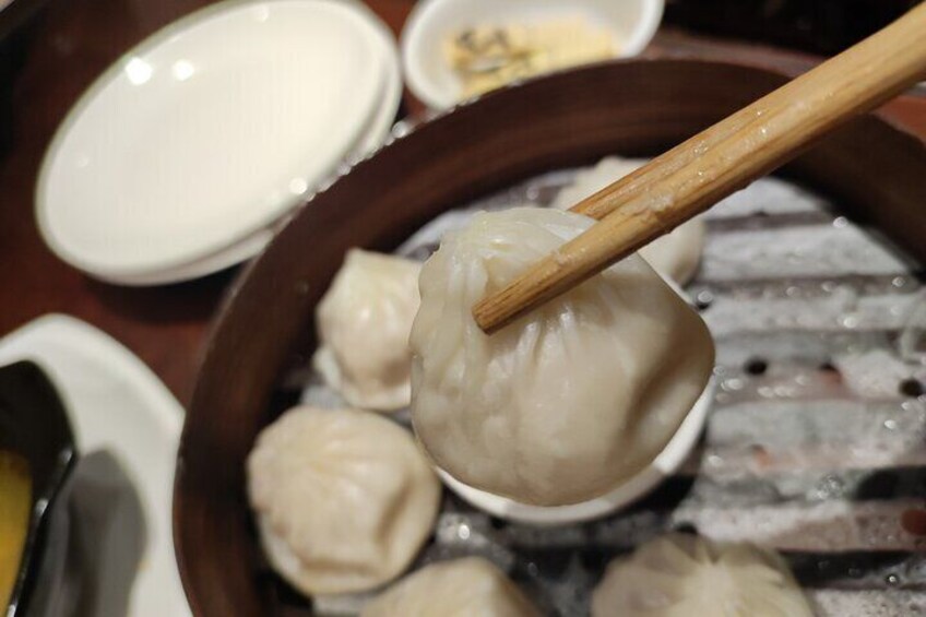 Taste xiaolongbao (soup dumplings)