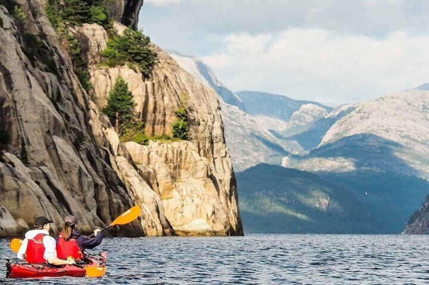 Steep mountains rising straight from the fjord, towering above you as you paddle further into the fjord.