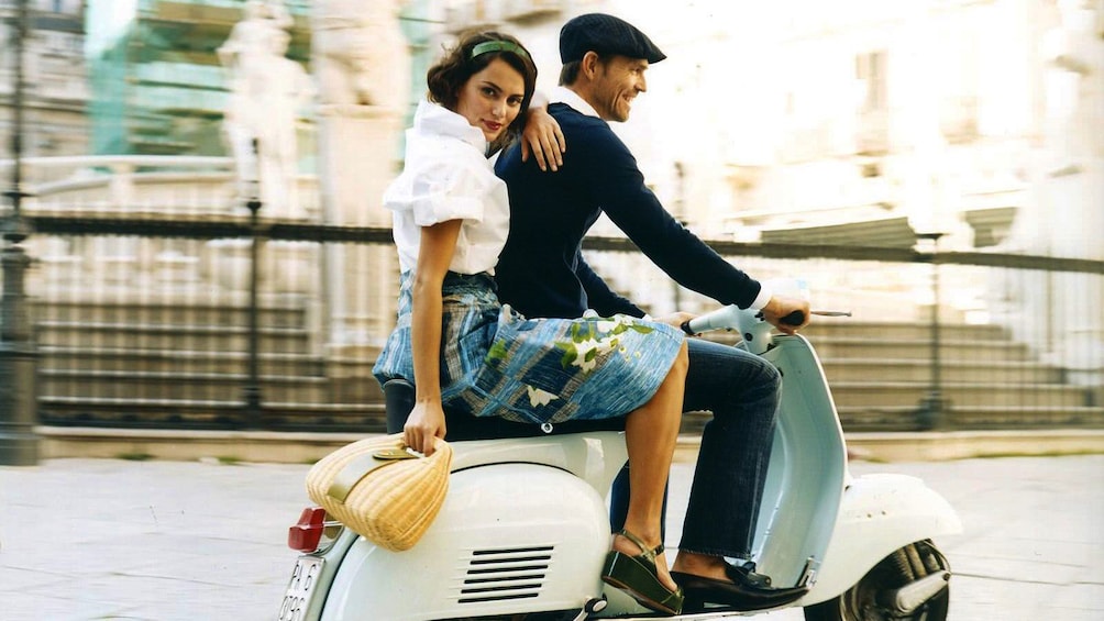 Show item 1 of 5. Couple on a Vespa in Rome