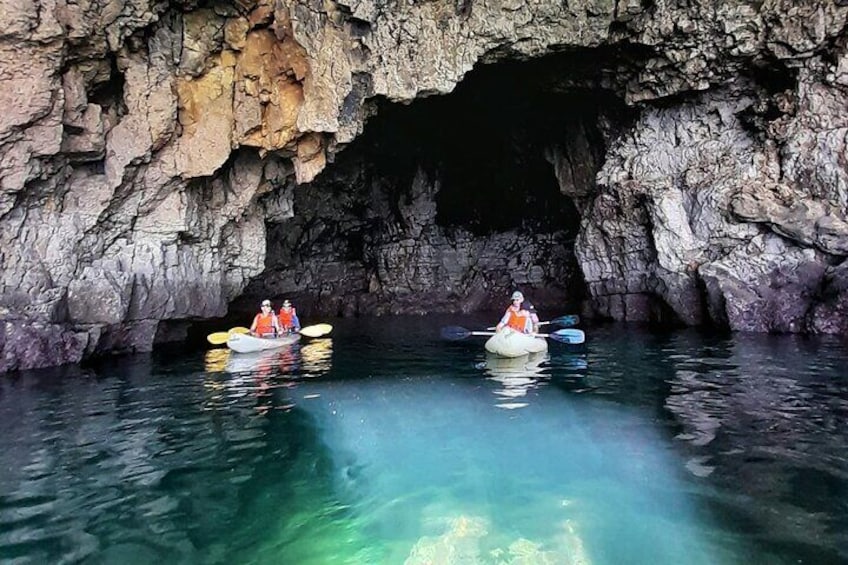 Exploring inside of Ingrina caves by kayak