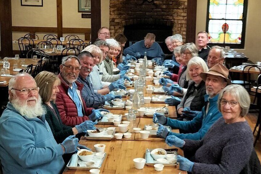 Group of visitors taking part in a Strudel construction. Permission to use this photo for a Hahndorf Walking Tours Viator listing only.