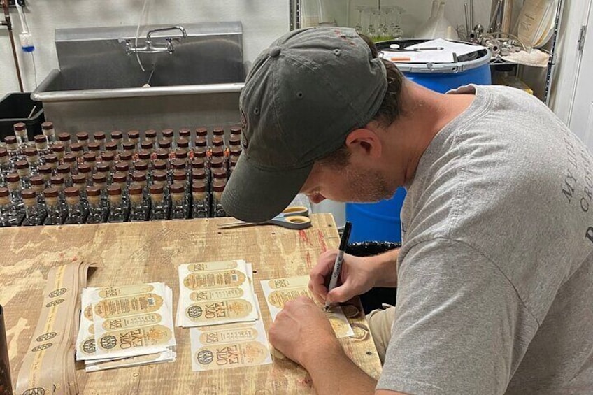 Rick one of the founders hand writes on every label of spirit we craft in house