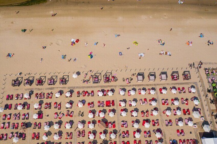 Jurmala beach, drone shot, full with people on sunbathing chairs