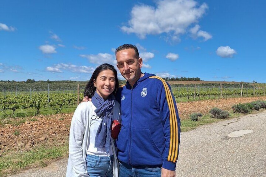 Guests in front of the vineyards on a very sunny beautiful day