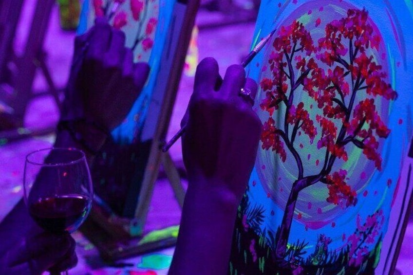 Paint a neon fluorescent picture while drinking unlimited wine