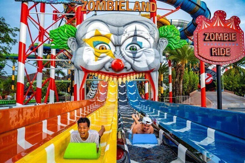 Survive the Zombieland slides: Escape zombie capture on the steepest free-fall slides and race headfirst on mats, dodging the clown zombie boss for a heart-pumping adventure!