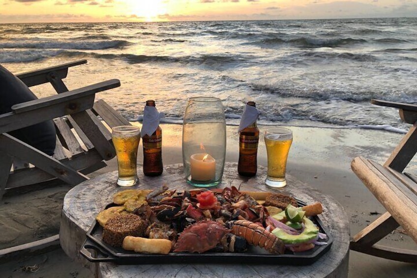 Dinner is a "picada marinera" on the beach at sunset. 