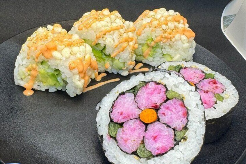 Make two sushi rolls: one with avocado and cucumber and the other with flower decorations!