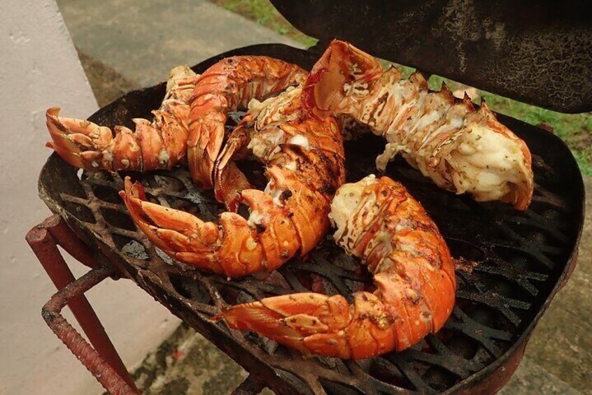 Grilled lobster, spiced and cooked in garlic butter