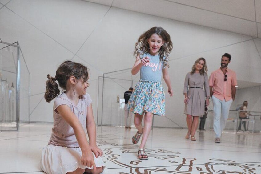 Curiosity unleashed: Children exploring and playing inside Louvre Abu Dhabi.