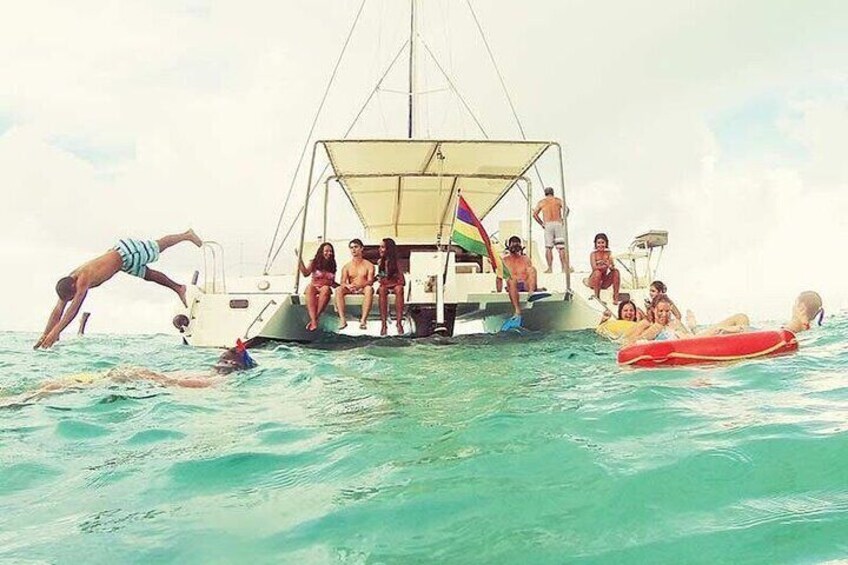 Swimming by the boat having fun