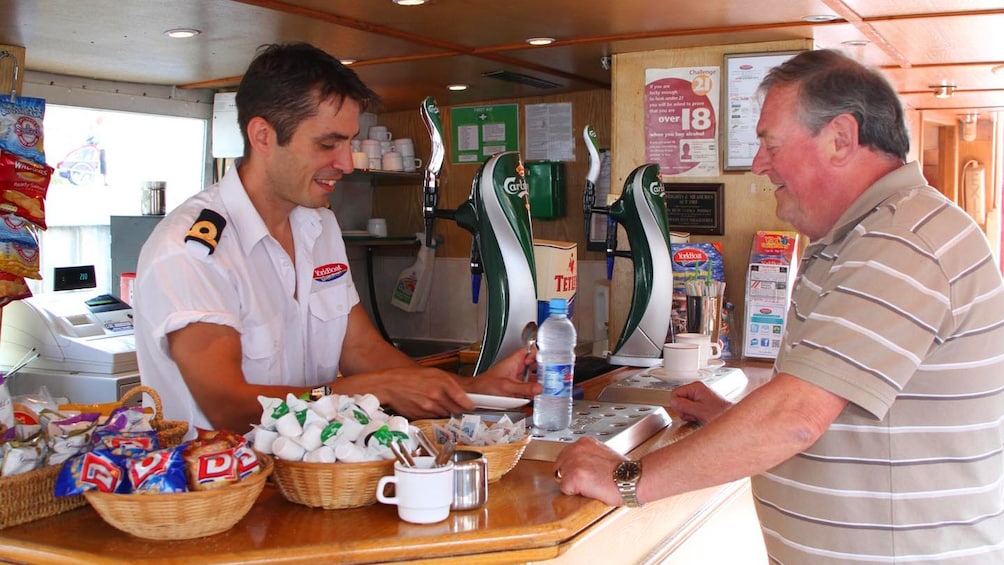 Man at concessions on a cruise boat
