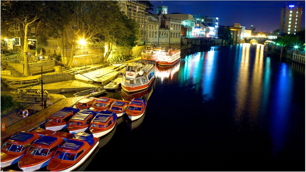 Boats on river at night