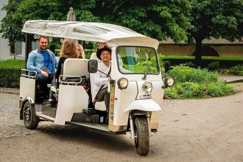 Fondue and wine private Tuk Tuk tour in Geneva