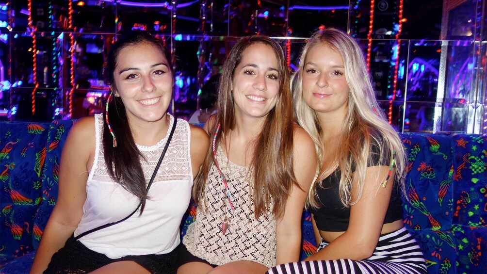 Group of ladies sitting inside a night club in Bangkok 