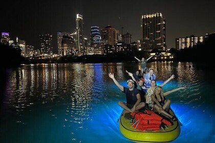 Giant Glow Paddleboarding the City centre Skyline with Bats