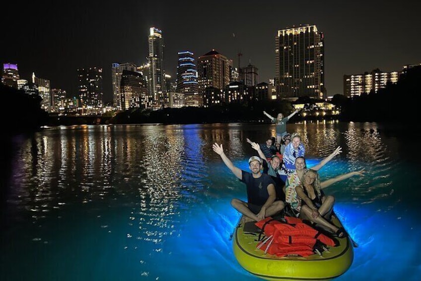 Giant Glow Paddleboard the Downtown Skyline at Sunset with Bats