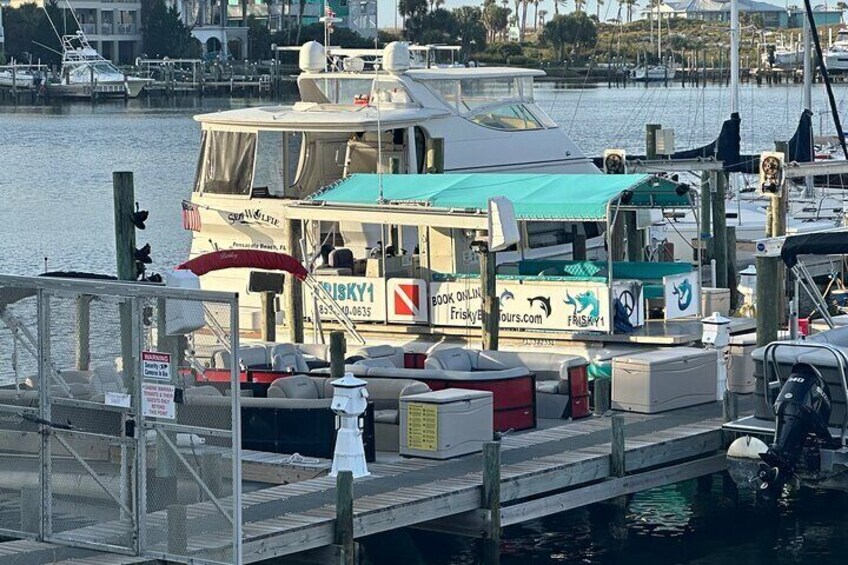 Frisky1 docked behind the Sandbar on Pensacola Beach.