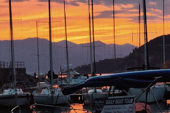 Aperitif on a boat at sunset, Porto Venere and islands