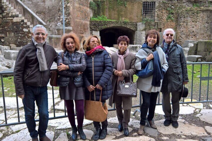 The guide with the group at the theatre of Marcellus