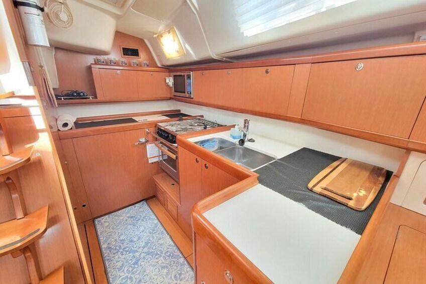 Galley with refrigerator and freezer.