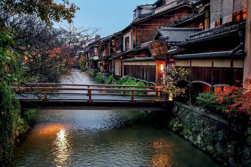 Local restaurants are bridged over the pretty canal, Shirakawa