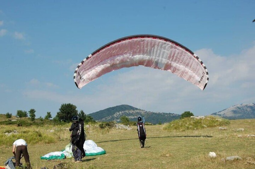 Paragliding flight over the Gardens of Ninfa