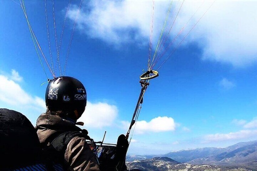 Paragliding flight over the Gardens of Ninfa