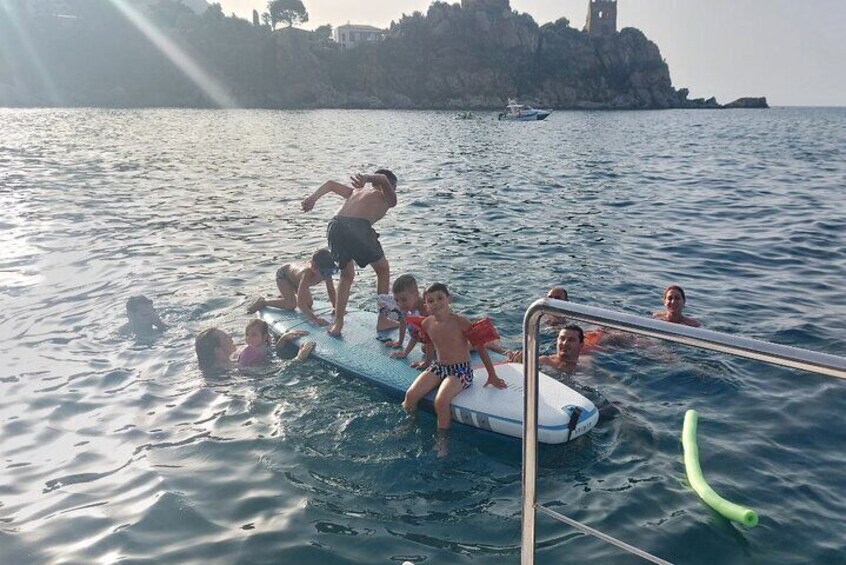 Discovering Cefalù's Coastline Activity on a Mini Catamaran