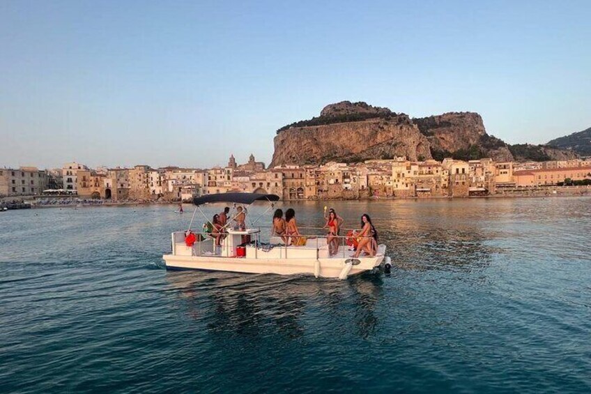 Discovering Cefalù's Coastline Activity on a Mini Catamaran