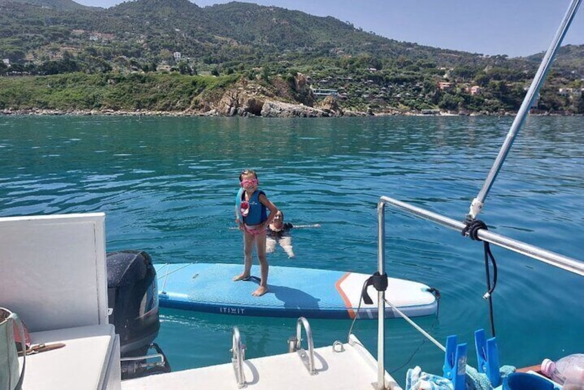 Discovering Cefalù's Coastline Activity on a Mini Catamaran