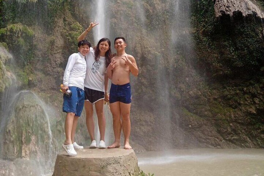 Guests in Tumalog Falls in Oslob