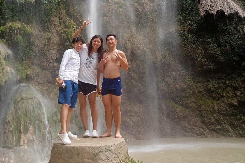 Guests in Tumalog Falls in Oslob