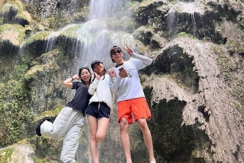 Guests in Tumalog Falls in Oslob