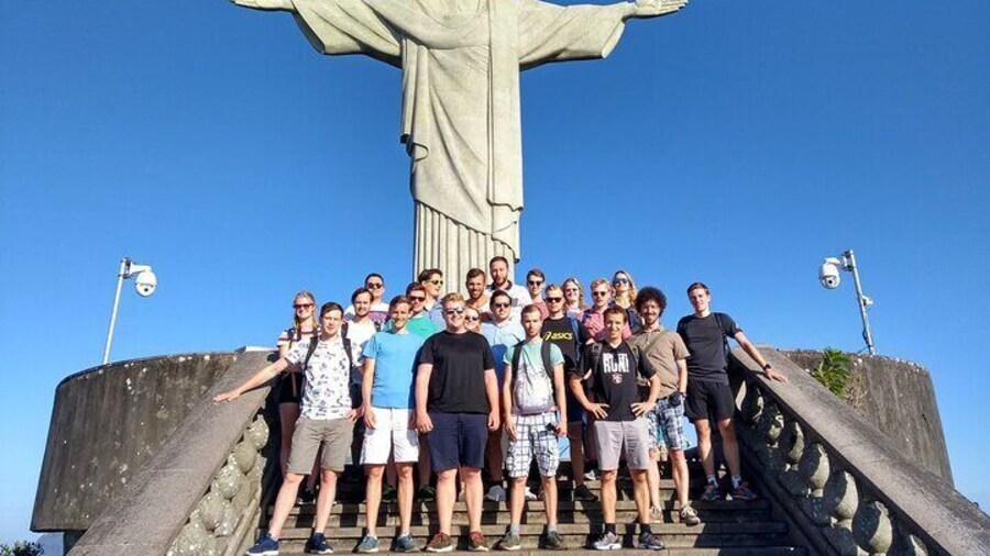 Iconic Landmark: Captured from a distance, this photo showcases the Christ the Redeemer statue as an iconic landmark of Rio de Janeiro.