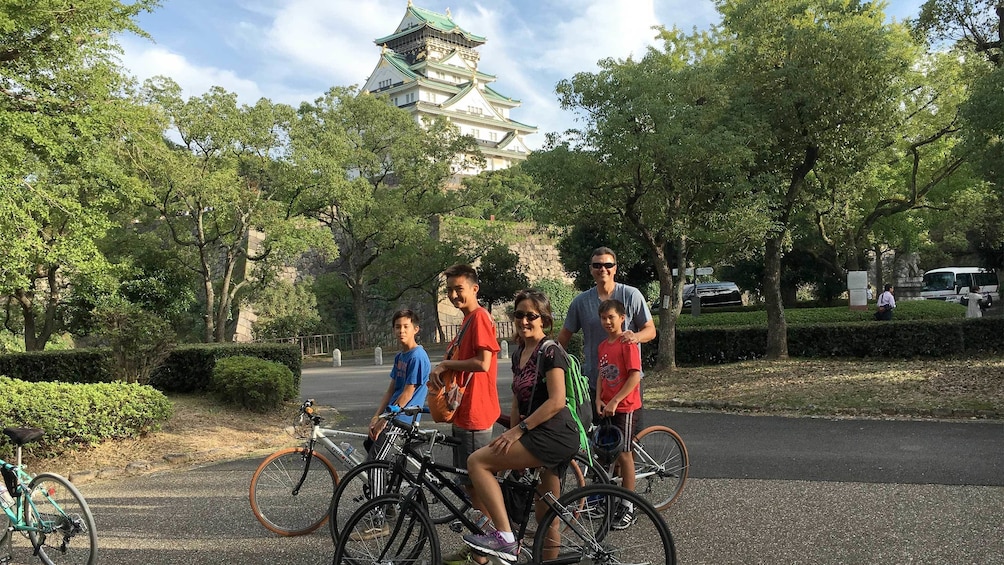 Show item 4 of 5. Family enjoying the Full-Day Cycling Tour of Osaka