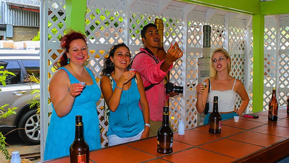People taking Rum shots in St. Lucia
