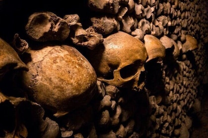Paris: Catacombs with Audio Guide & Optional River Cruise