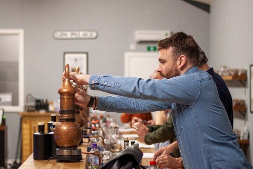 Man placing lid on copper pot