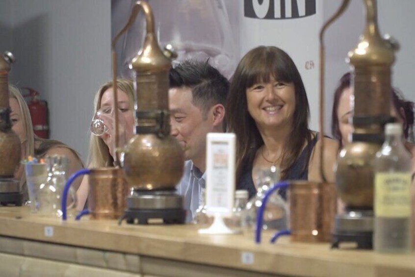 Woman smiling at Nelson's Gin & Vodka School