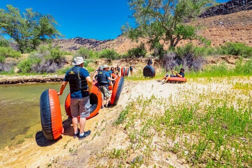 Prepare for a tubing adventure on the Virgin River in Zion with friends