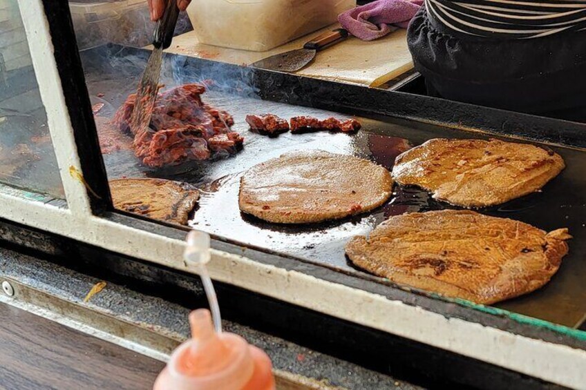 See how street food is made (vegan milanesa and chorizo depicted here)