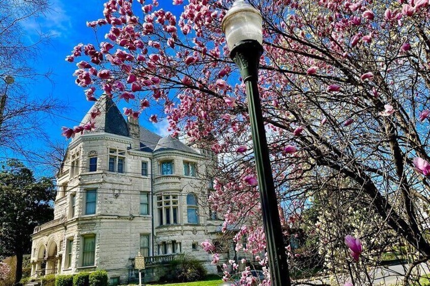 Enjoying a view of Conrad's Castle from Olmsted-designed Central Park, the green heart of Old Louisville