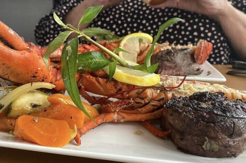 Rib eye and 1/2 a lobster with seasonal vegetables INCLUDED!