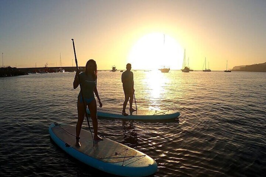 Couple enjoying the Sunset SUP Session