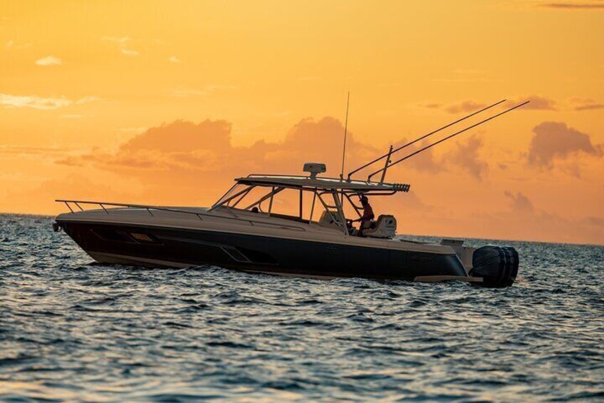 Golden hour on the water: Experience the Bahamian sunset like never before, aboard our luxury cruiser