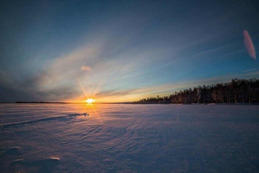 Ice Fishing on a Frozen Lake in Levi