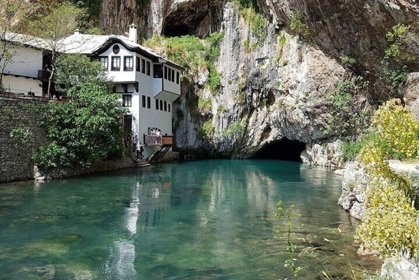 Blagaj - Spring of Buna river in the cave with Dervish tekija monastery or Turkish house on the left.