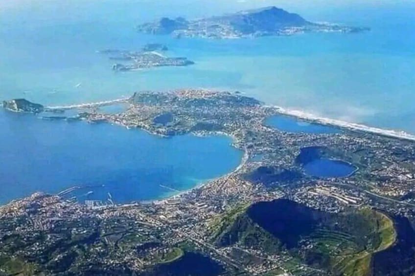 The Campi Flegrei are a vast active volcanic area with a structure called "caldera", that is, a low-lying area of almost circular shape that was formed as a result of large explosive eruptions.